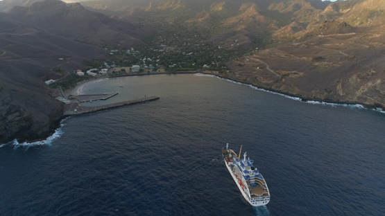 Ua Pou, aerial view of the village Hakahau and cargo ship in the bay, 4K UHD
