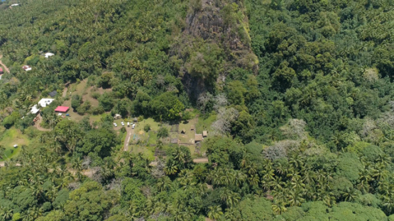 Hiva Oa, aerial view above Iipona site and tiki, village of Puamau, 4K UHD