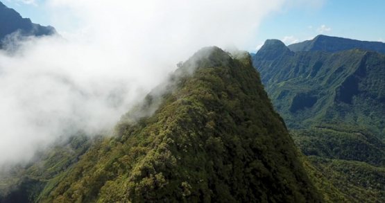 Tahiti 4k drone, aerial view of a peak and the clouds