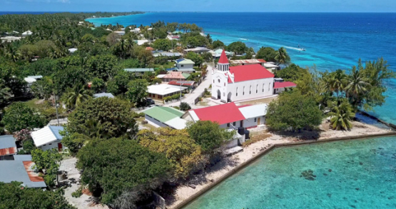 Rangiroa 4k drone, aerial view of the Sanito church, in front of the Avatoru pass