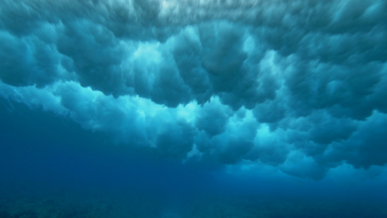 Tahiti, foam of wave on the shorebrake from underwater, 4K UHD
