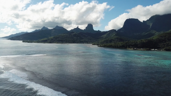 Aerial view by drone of west coast of Moorea and barrier reef, 4K UHD