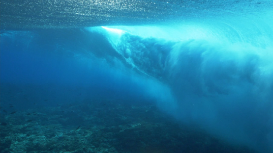 Tahiti, Big wave rolling shot from underwater near the shore break