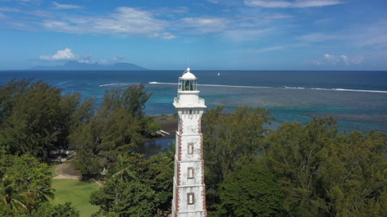 Tahiti, aerial drone view of the Light house of Pointe Venus, Moorea in the background