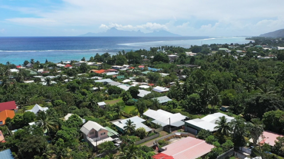 Tahiti, aerial drone view of the coast line and Paea village