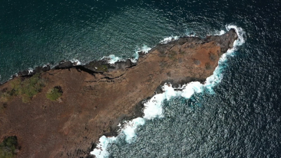 Hiva Oa, aerial top down drone view above the coast line of Puamau