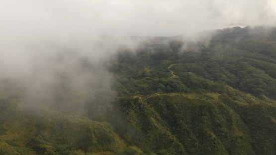 Hiva Oa, aerial drone view of the mountain under the cloud