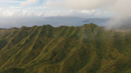 Hiva Oa, aerial drone view of the mountain under the cloud