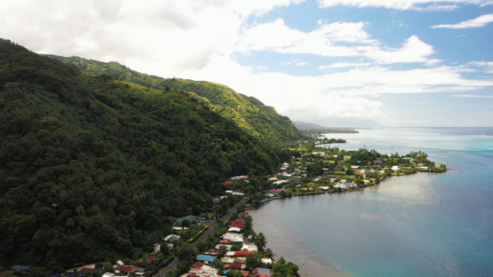 Tahiti, aerial drone view of the coast line and Paea village