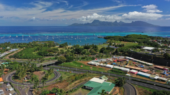 Tahiti, aerial drone view of traffic jam, Moorea in the background