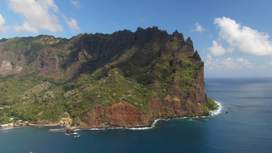 Fatu Hiva, aerial drone view of Omoa bay and rocky mount, marquesas islands, 4K UHD