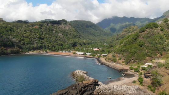 Fatu Hiva, aerial drone view of villlage Omoa and bay, marquesas islands, 4K UHD