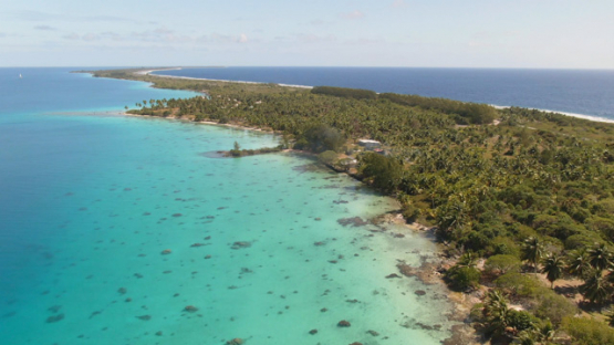 Fakarava, aerial view by drone of the long islet of the north, 4K UHD