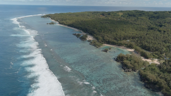 Rimatara, aerial view by drone of the coastline of Mutuauru, 4K UHD