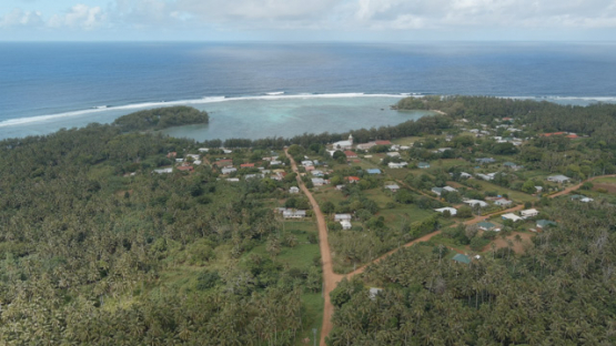 Rimatara, aerial view by drone of the village of Mutuaura, 4K UHD