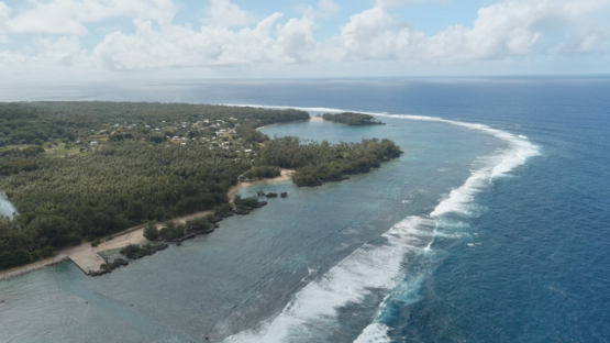 Rimatara, aerial view by drone of the coastline of Mutuaura, 4K UHD