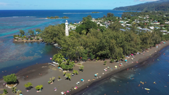 Tahiti, aerial view by drone of the beach and lighthouse of Pointe Venus, 4K UHD