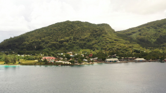 Huahine, aerial view by drone of the town Fare from the lagoon, 4K UHD
