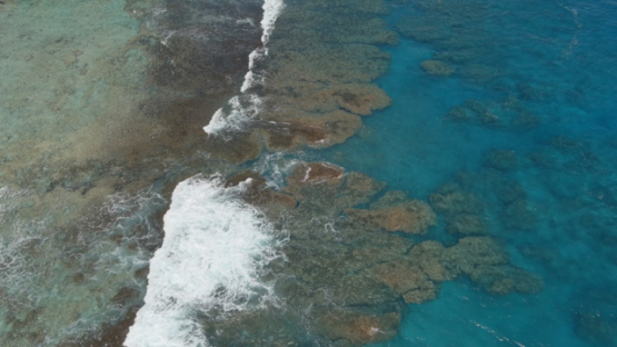 Rimatara, aerial view by drone over the reef of Mutuaura, 4K UHD