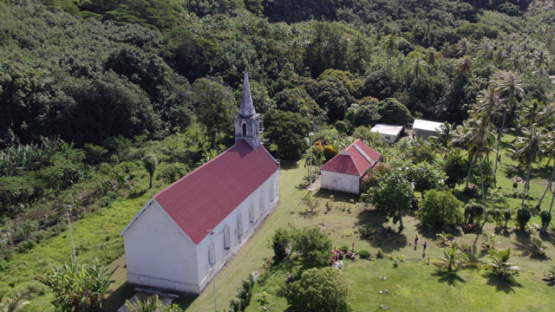 Taravai, Aerial drone view of the church Saint-Gabriel, Gambier archipelago, 4K UHD