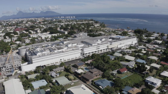 Aerial drone view of hospital Taone, town of Arue, Tahiti, 4K UHD