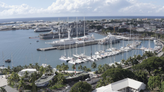 Papeete aerial drone view, marina, sailboats, and cruise ships, 4K UHD