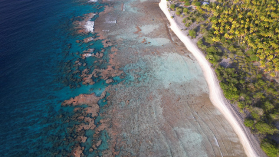 Faaite, aerial drone view of the island and barrier reef, 5K4