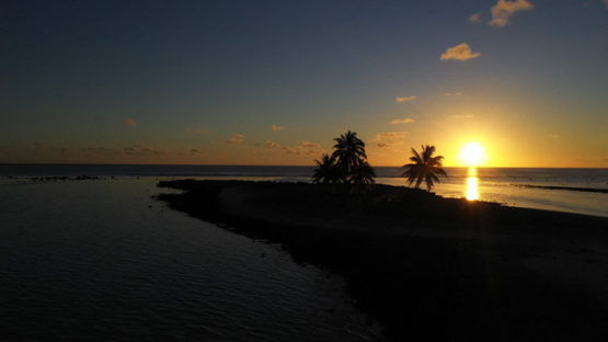 Hikueru, Aerial view of atoll, Tuamotu, sunset on Barrier reef, Lagoon, UHD