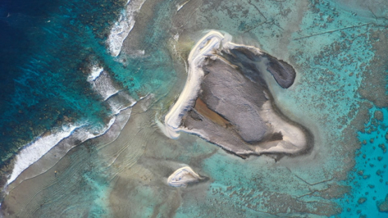 Hikueru, Aerial top view of atoll, Tuamotu, Barrier reef, sand islet formation, UHD