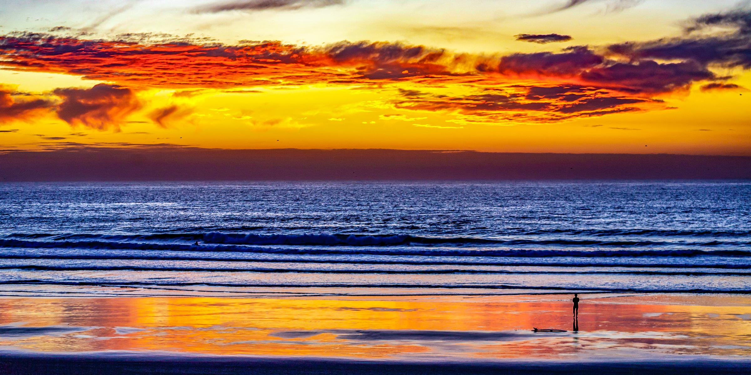 Lone Surfer at Sunset