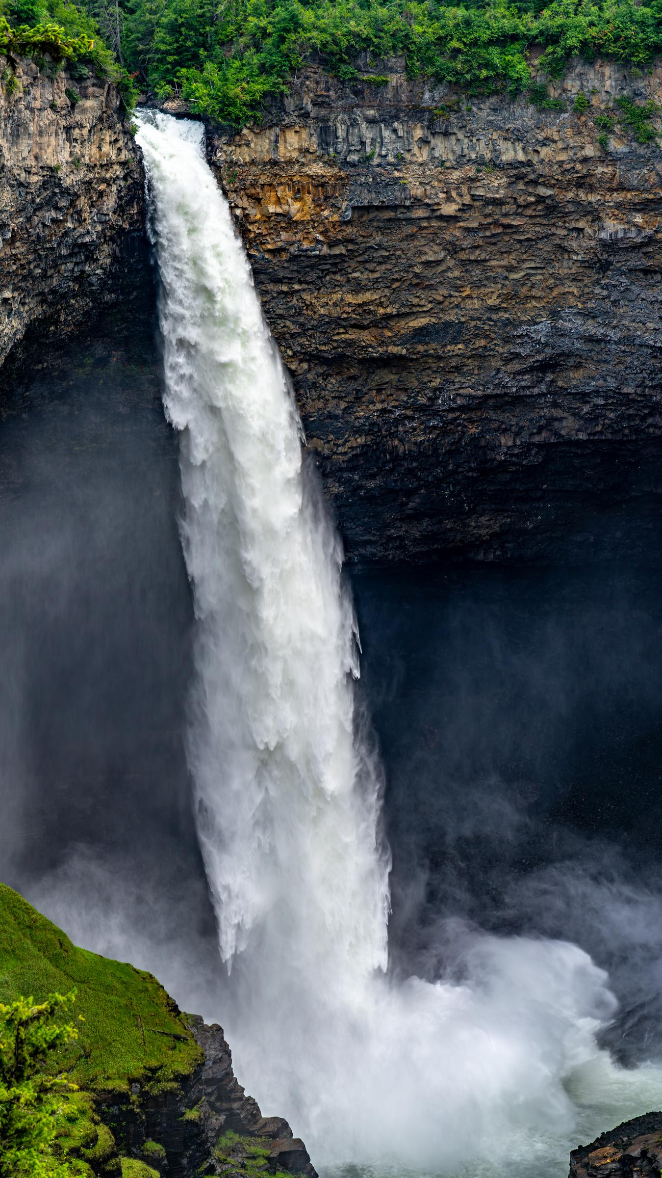Massive waterfall plunging into a dark chasm Helmcken Falls British Columbia Canada