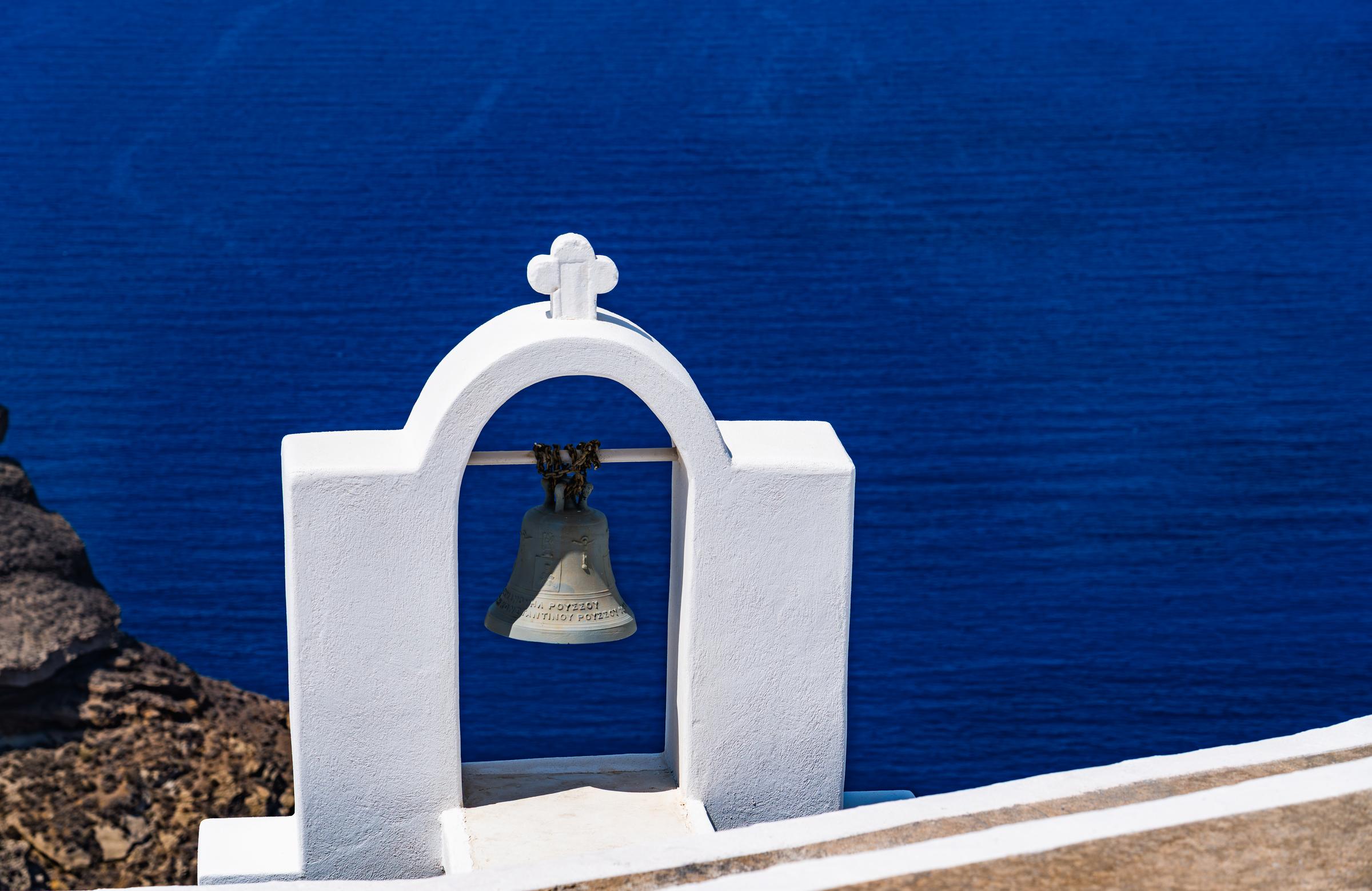 White bell tower overlooking the sea Fira South Aegean Greece