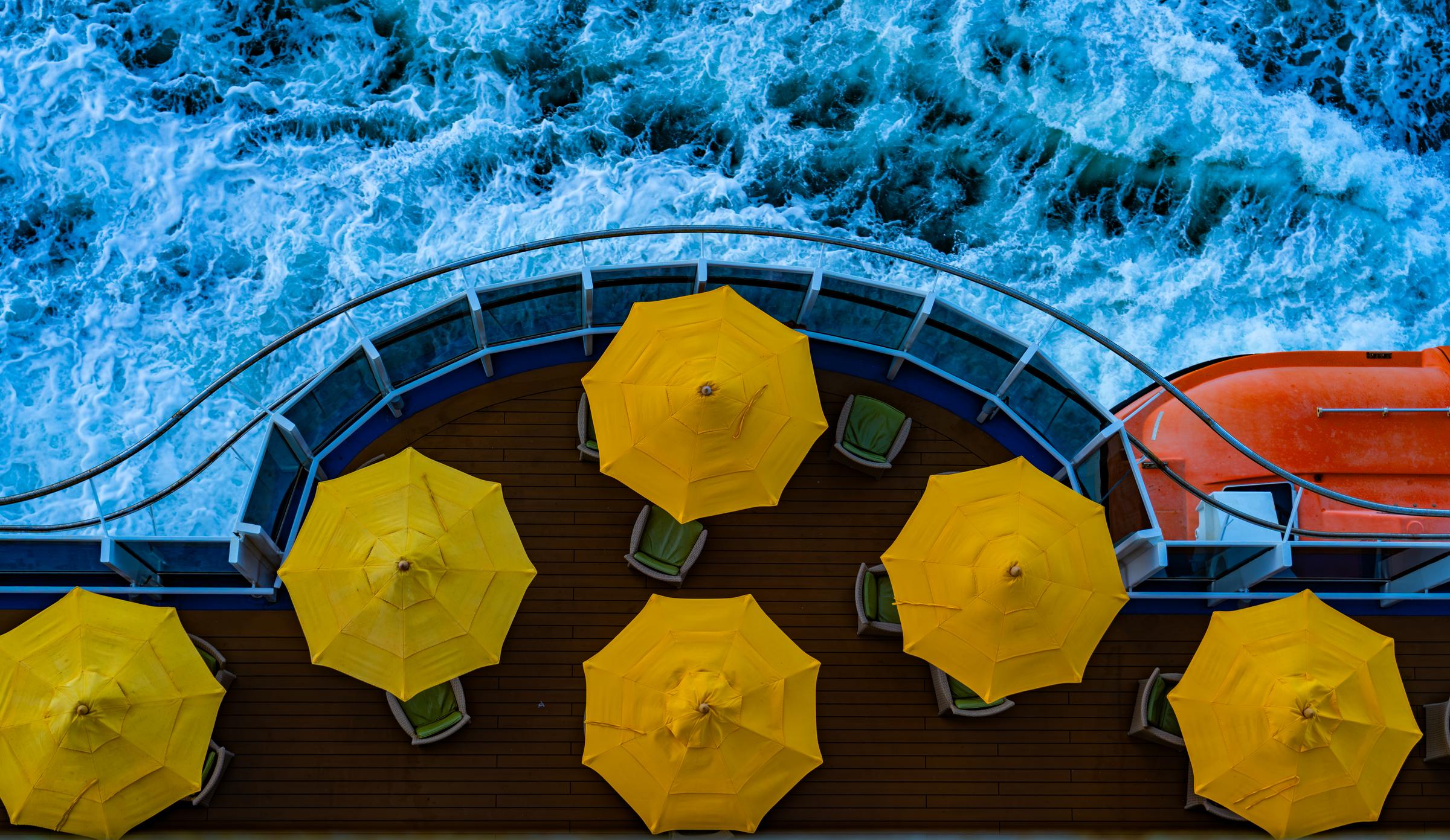 Yellow umbrellas on a cruise ship deck