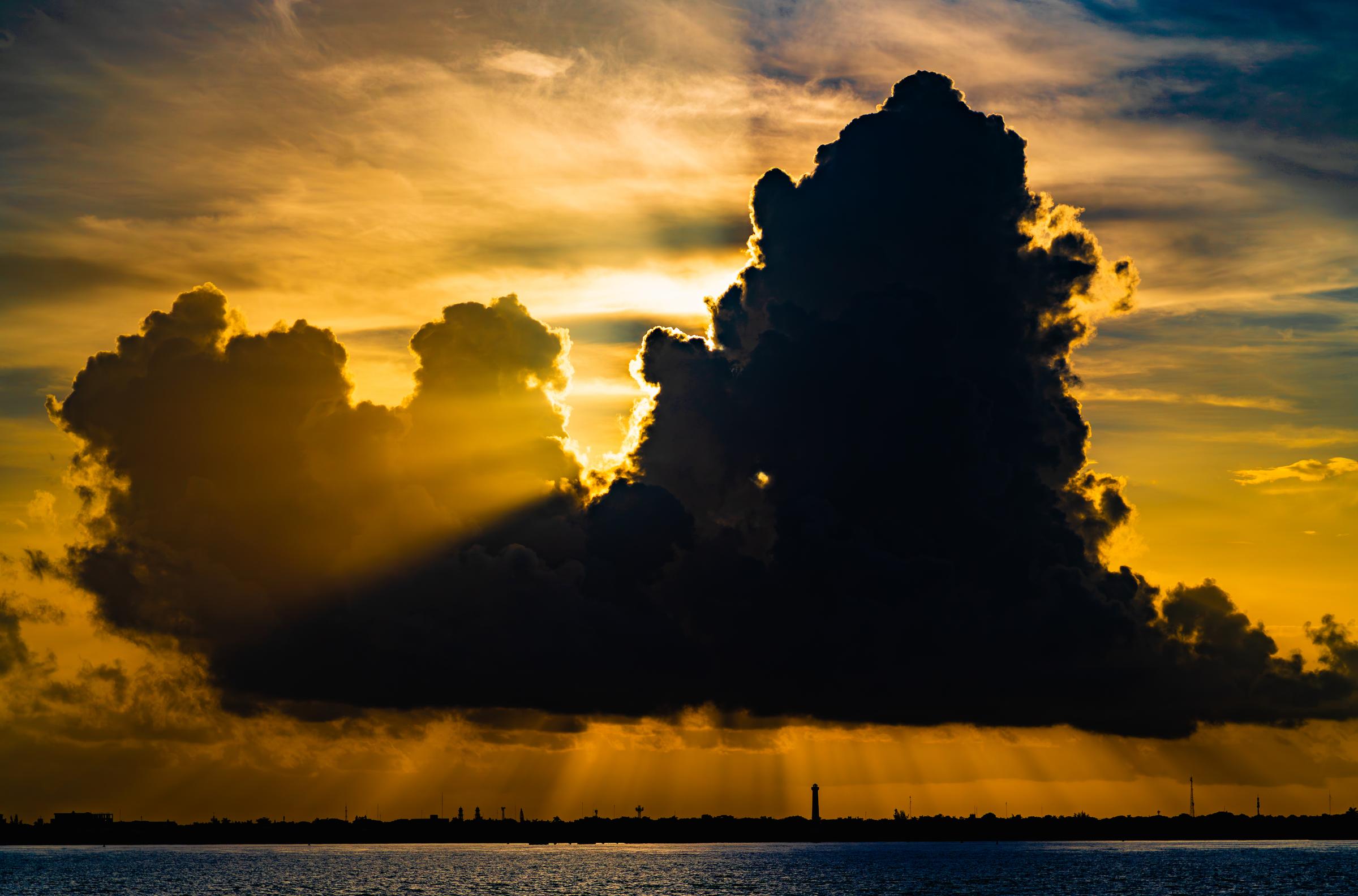 Sunlight Breaking Through Clouds Over Water San Miguel De Cozumel Quintana Roo Mexico