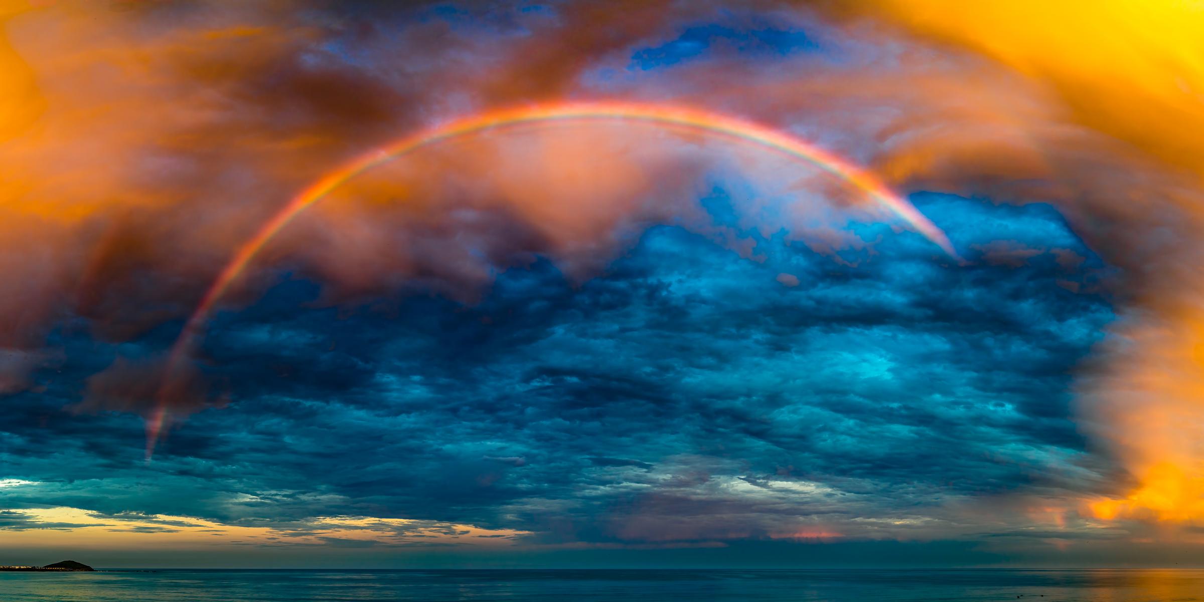 Vibrant Rainbow over the Ocean