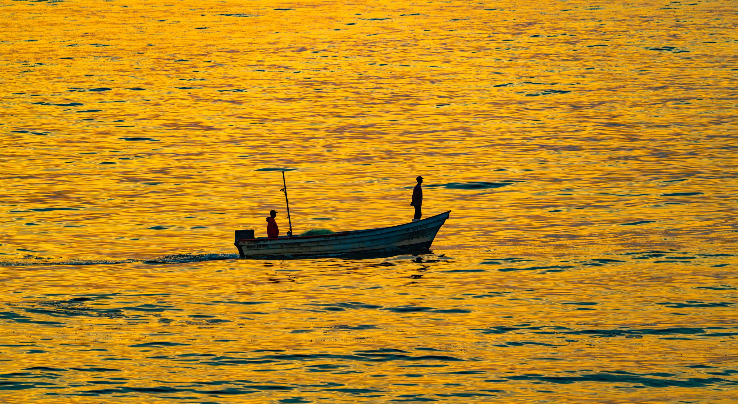 Silhouetted boat at sunset Mazatlan Sinaloa Mexico