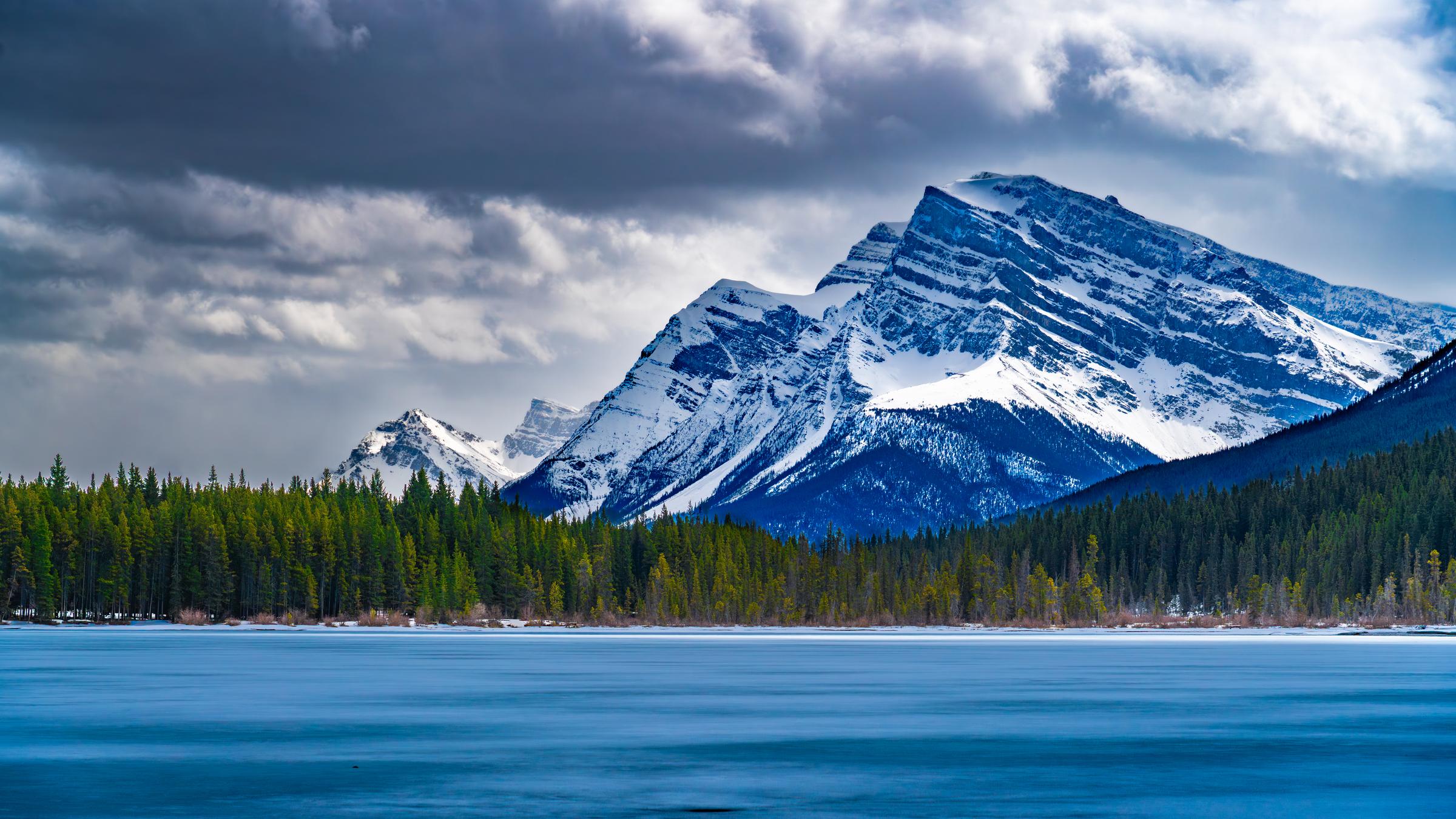 Snow-Capped Mountains Over Frozen Lake Waterfowl Lake AB Canada