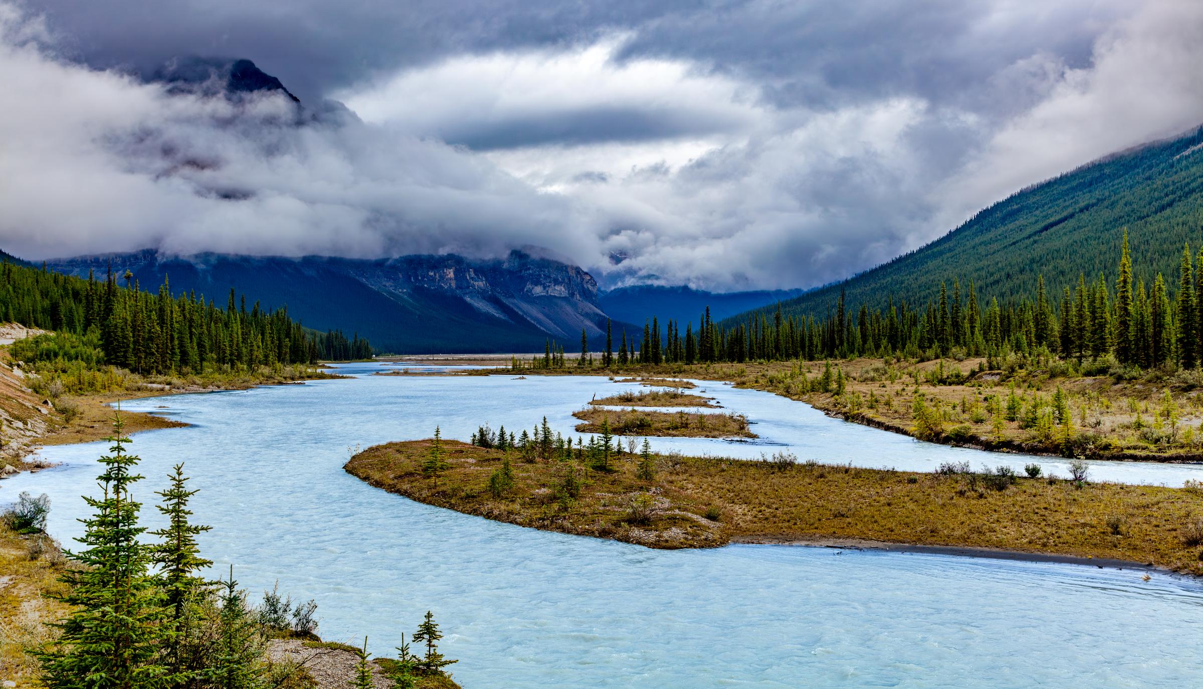 River flowing through a mountain valley Sunwapta Falls AB Canada