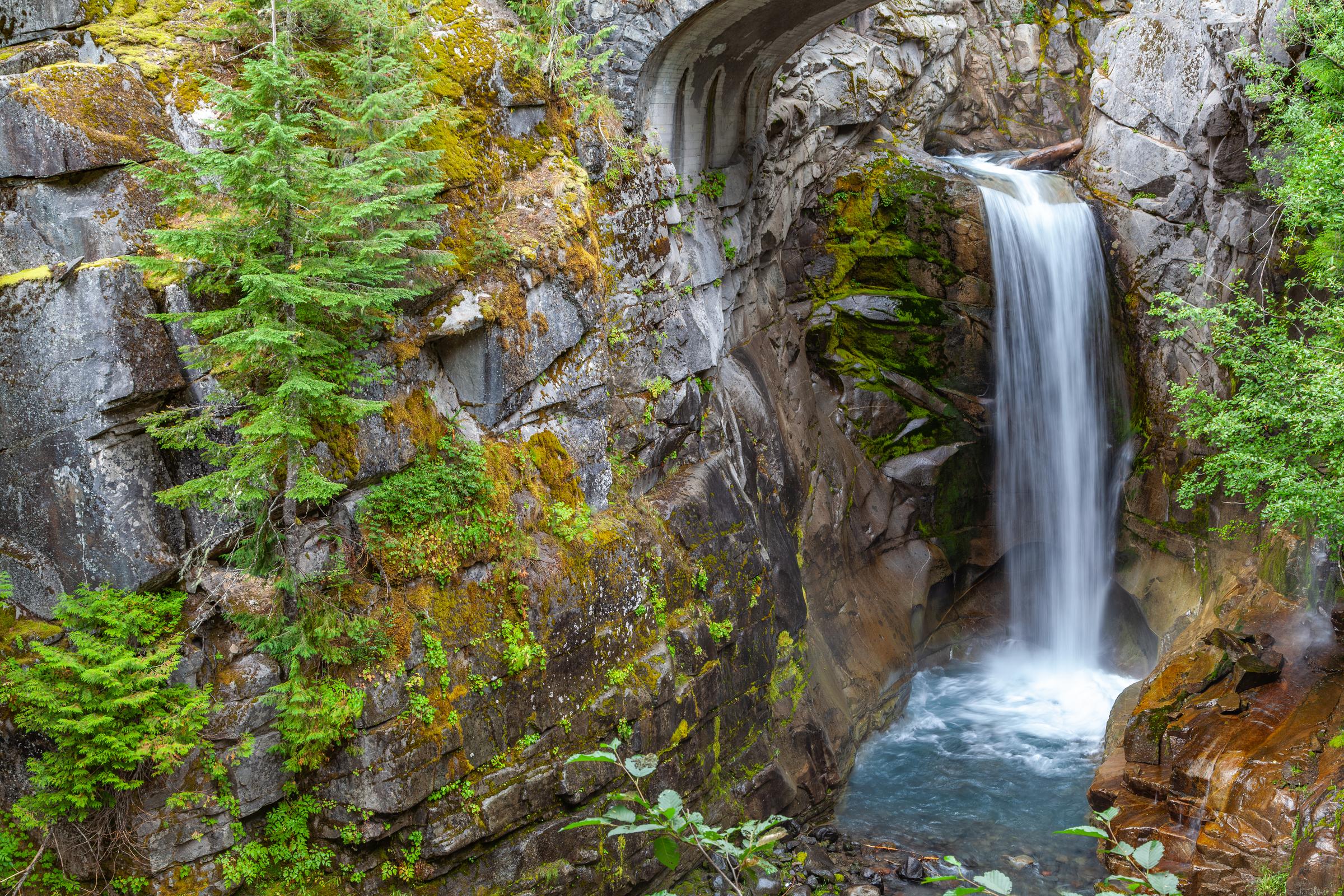 Waterfall through Rock Arch Mount Rainier Washington State United States
