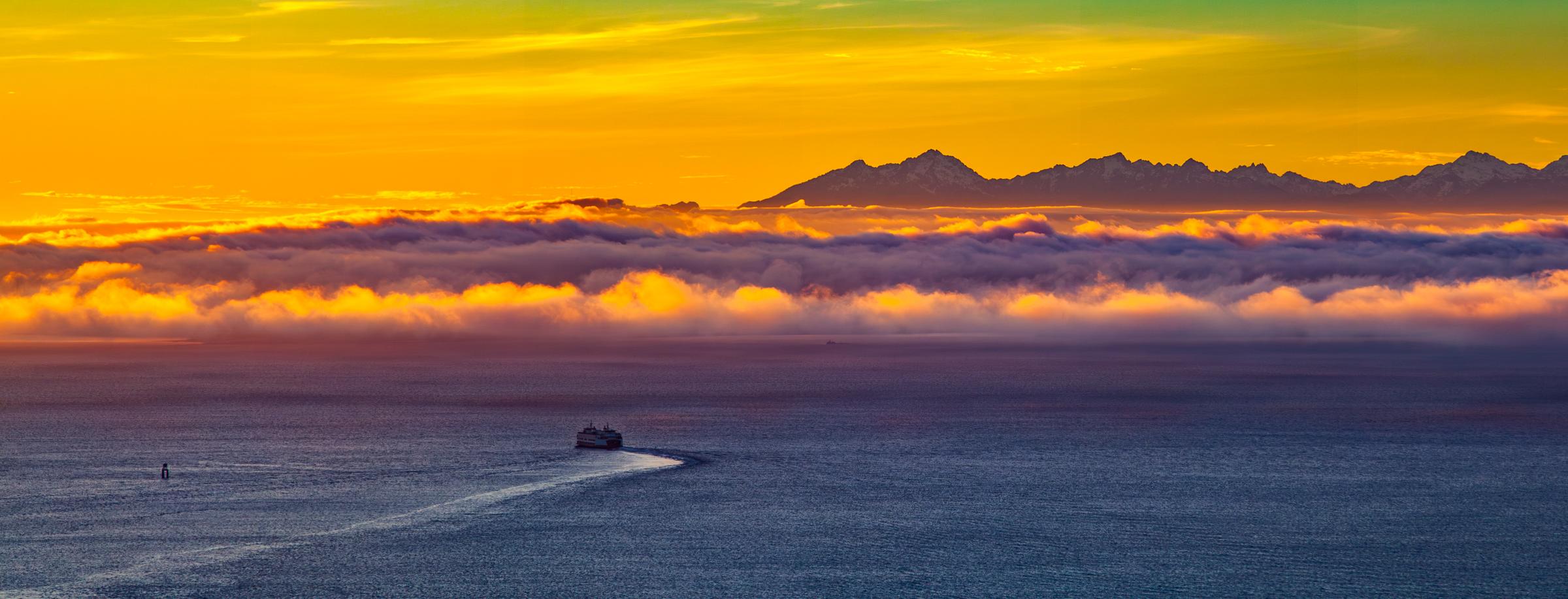 Sunset over the ocean with a boat Seattle Washington United States