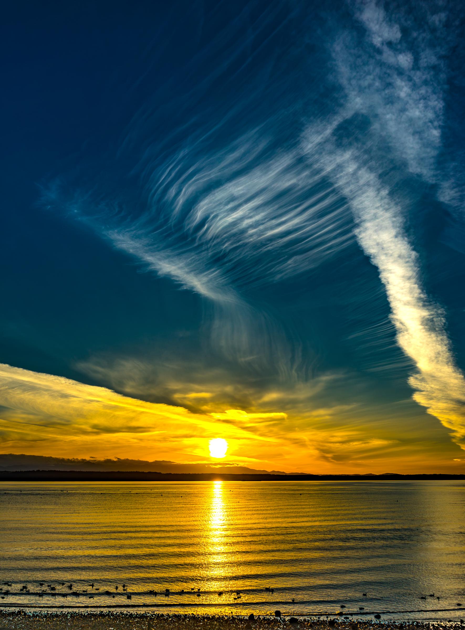 Sunset over water with cirrus clouds Edmonds Washington State United States
